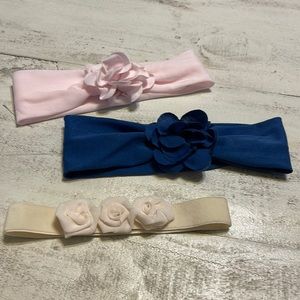 Lot of three soft baby girl headbands with flowers. Navy blue, pink and cream.
